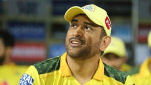 closeup view of ms dhoni is wearing yellow dress and cap hd dhoni
